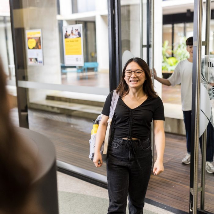 UNSW College student with bag, walking to class