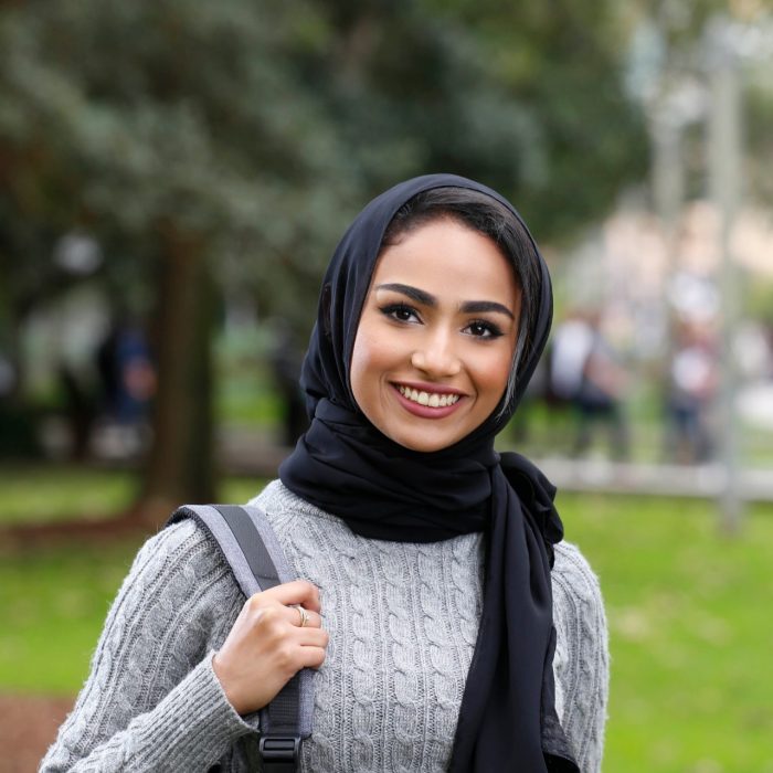 Female student with backpack outside