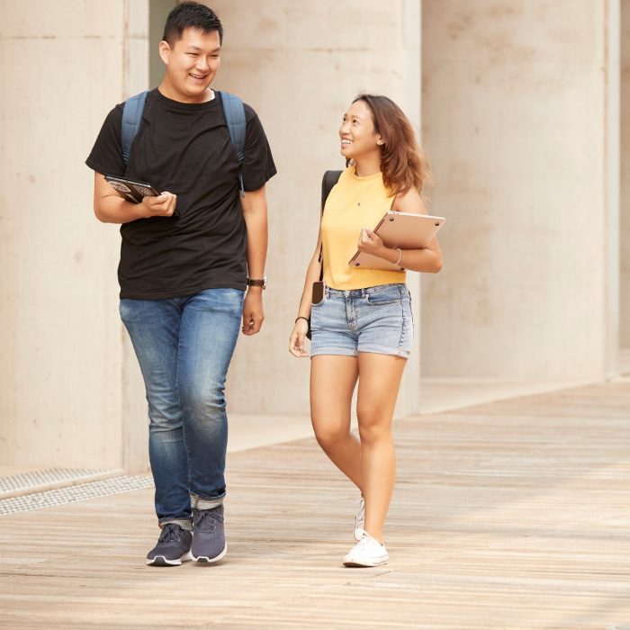 Couple of Students walking in L5 courtyard