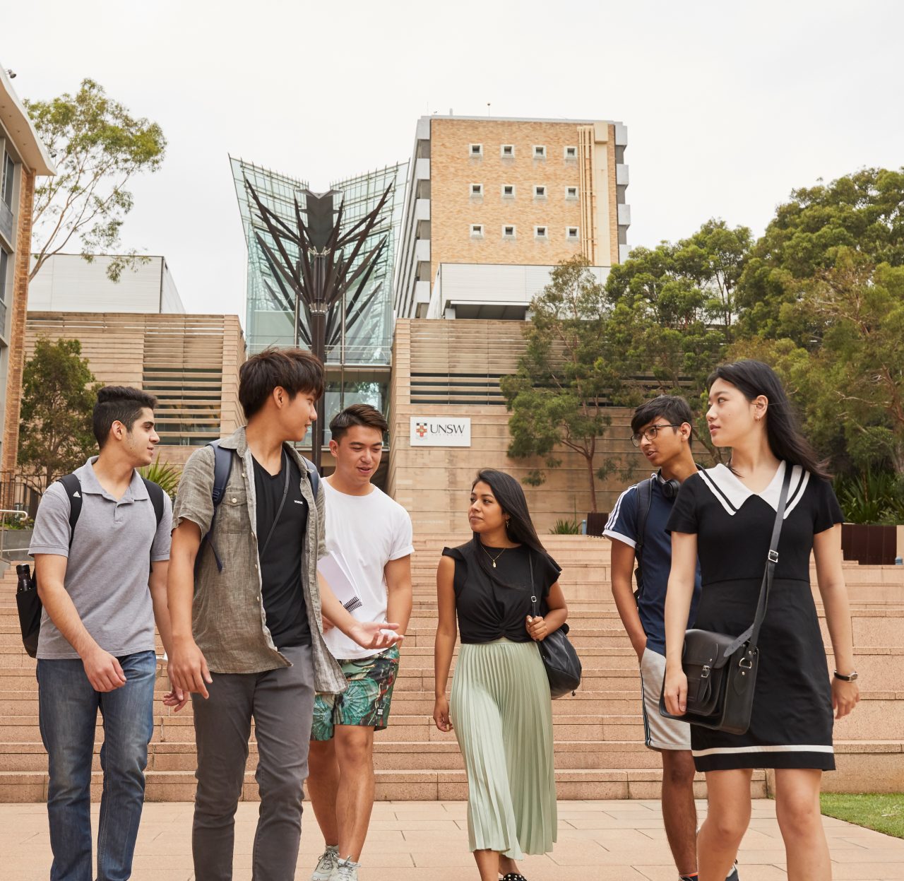 Students on walking down steps on campus